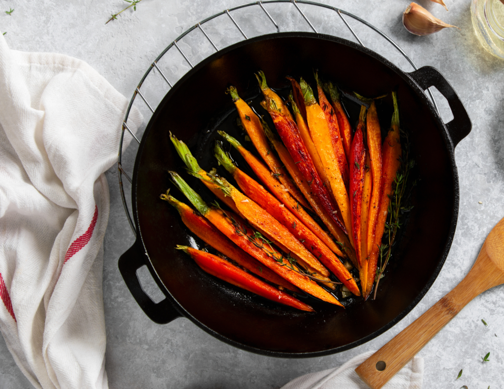 An image of roasted carrots as part of a plant-based new years eve dinner